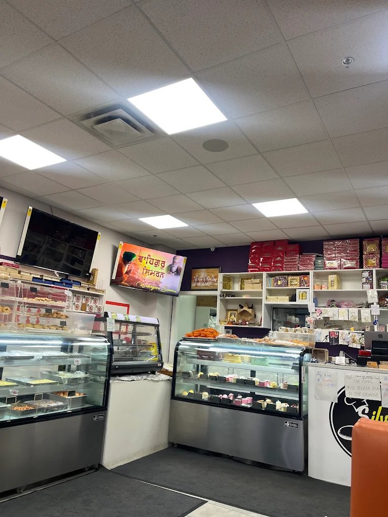 Silver Spoon store interior with mithai and cake counters