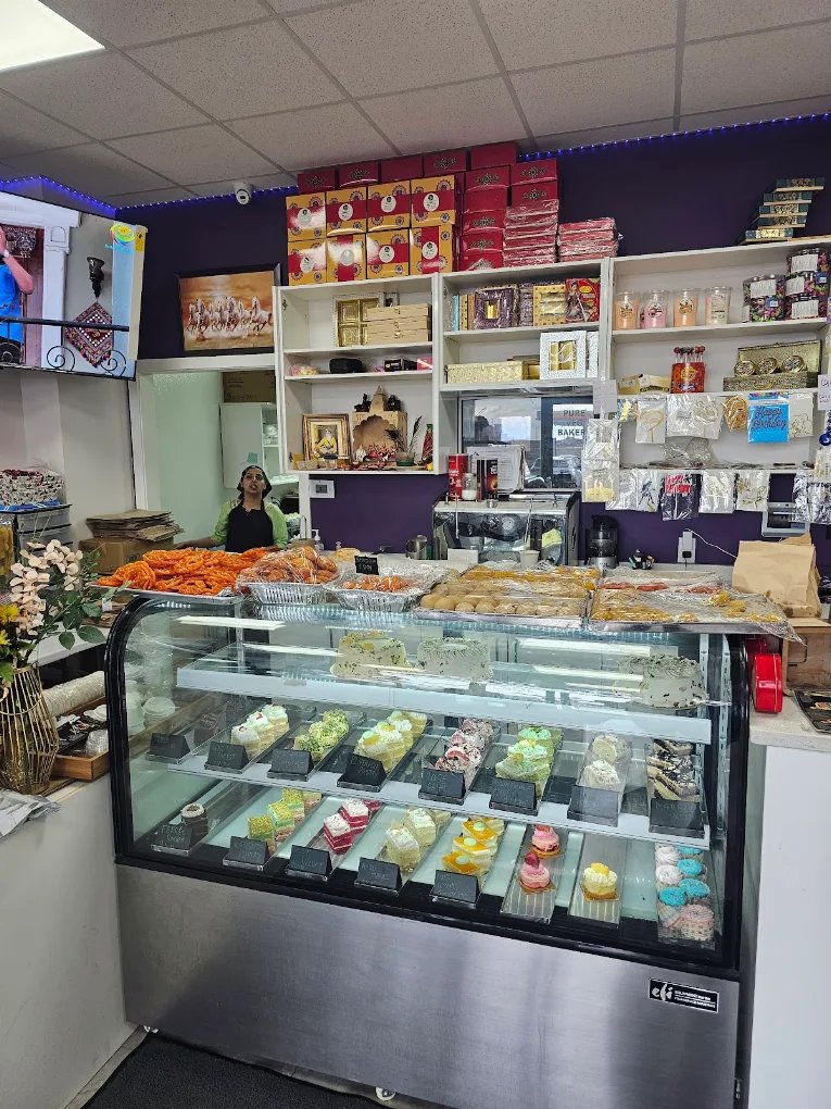Silver Spoon bakery counter with cakes, mithai and shelves of sweets