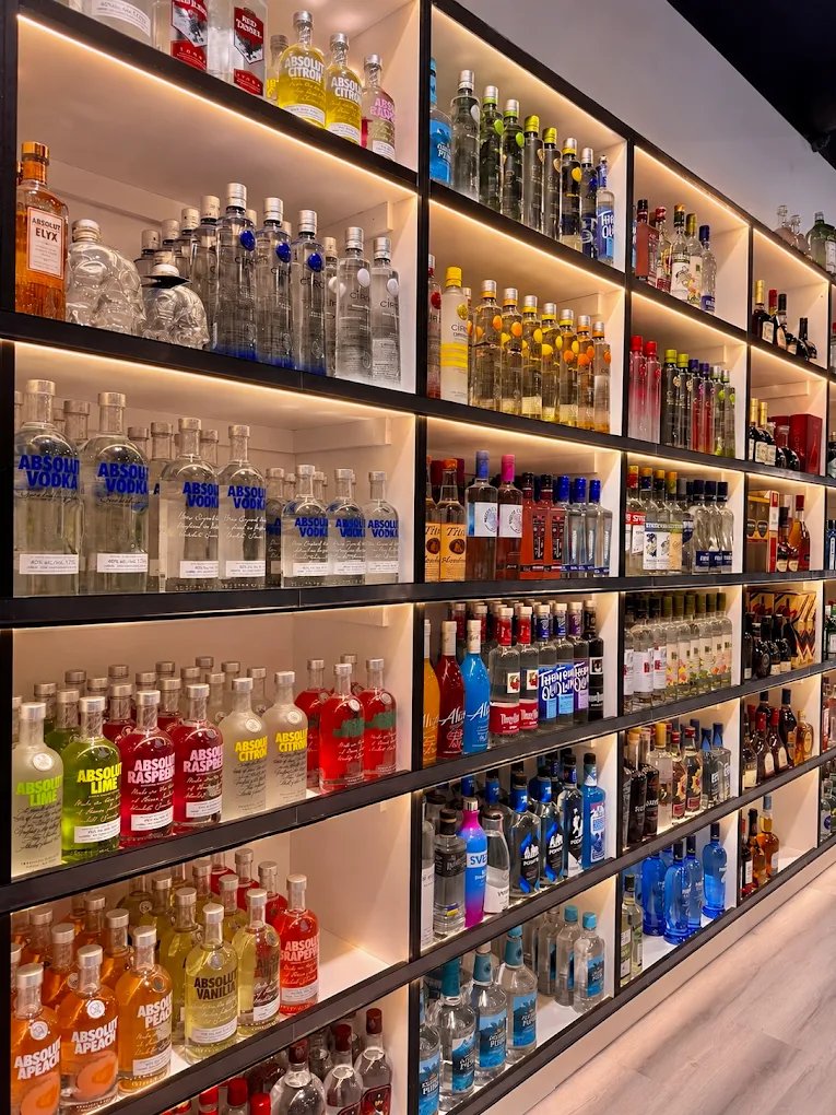 Illuminated vodka and spirits wall at Liquor Stars Edmonton