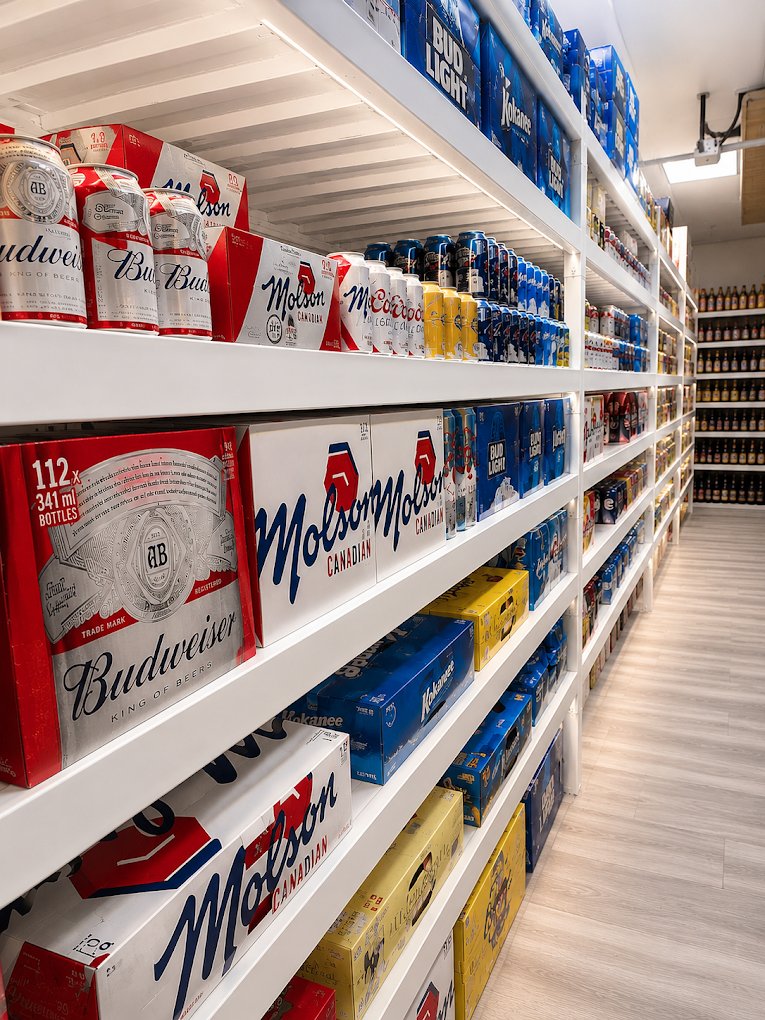 Beer aisle and stocked shelves inside Liquor Stars Edmonton