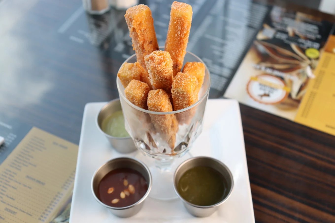 Crispy paneer sticks with three dipping chutneys