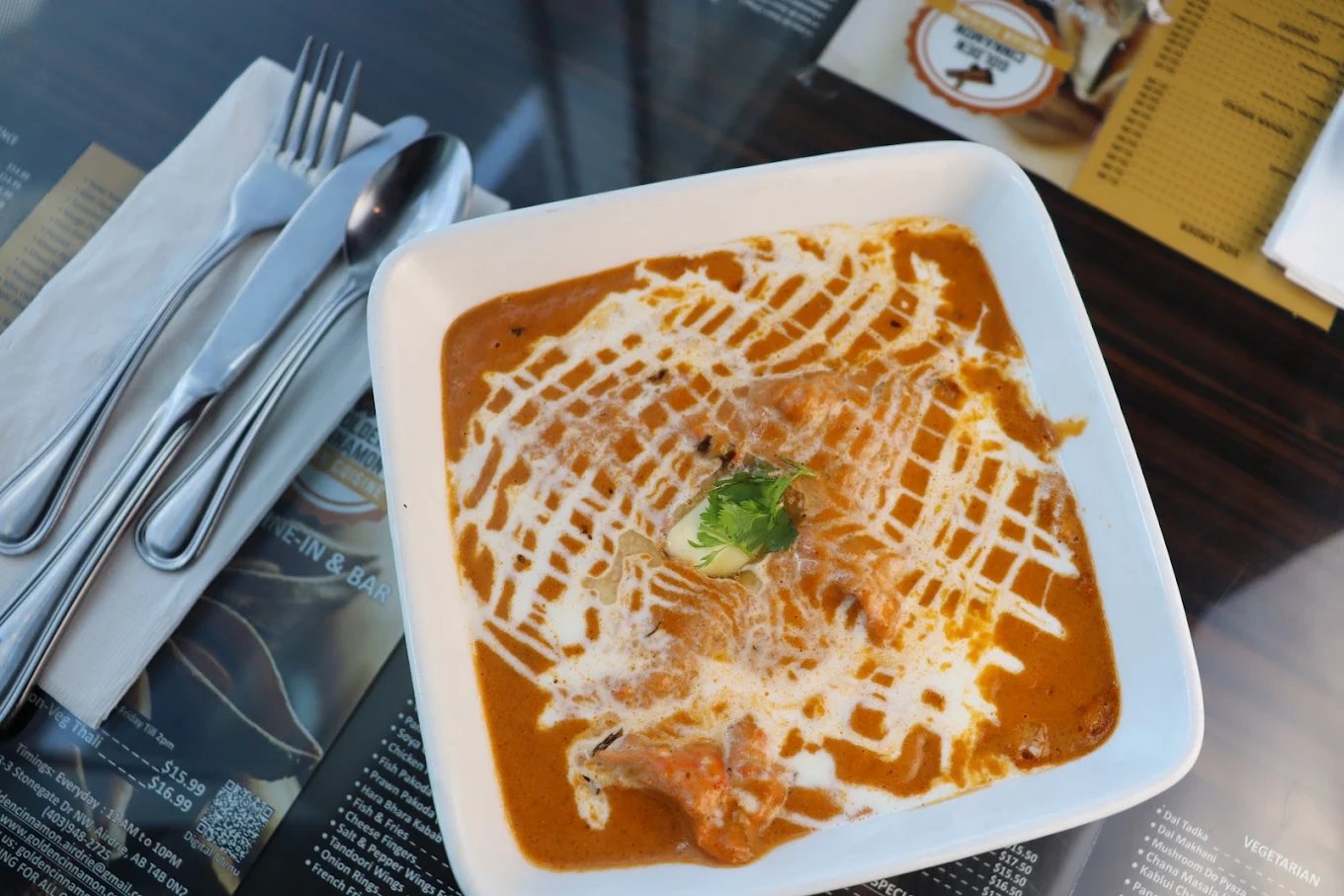 Creamy butter chicken drizzled with cream