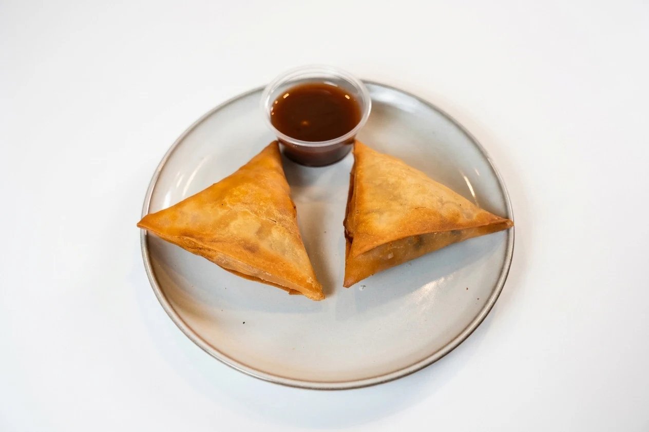 Golden samosas with tamarind dipping sauce