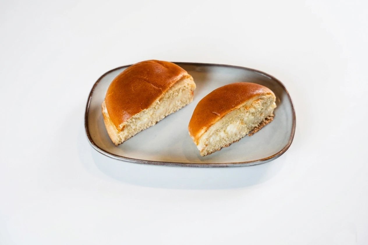 Fresh cream-filled buns on a plate