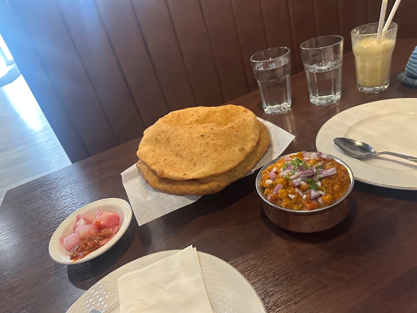 Chole bhature with pickle and lassi