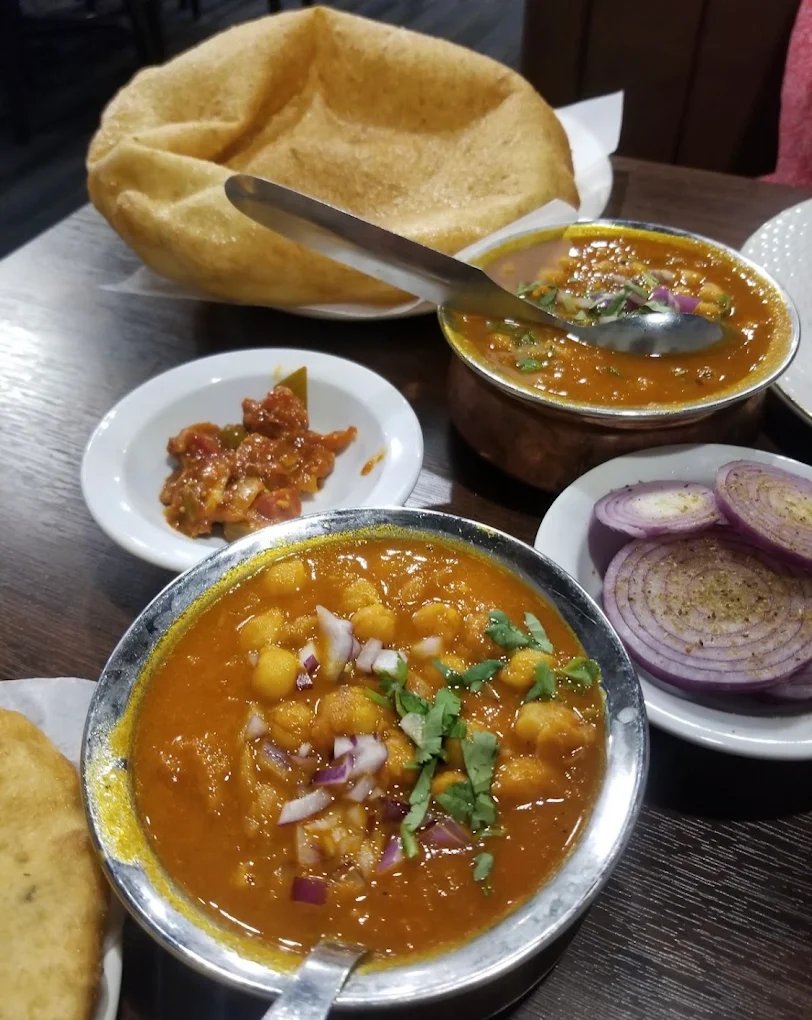 Butter chicken curry served at Pind Punjab Edmonton