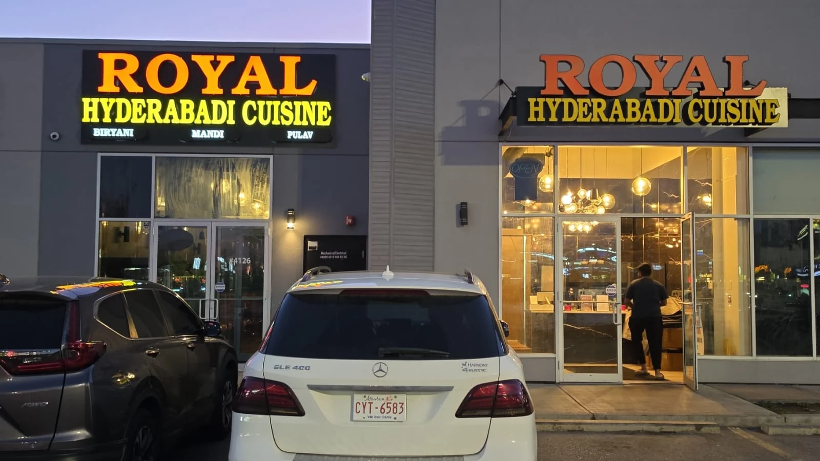Royal Hyderabadi Cuisine storefront and illuminated sign