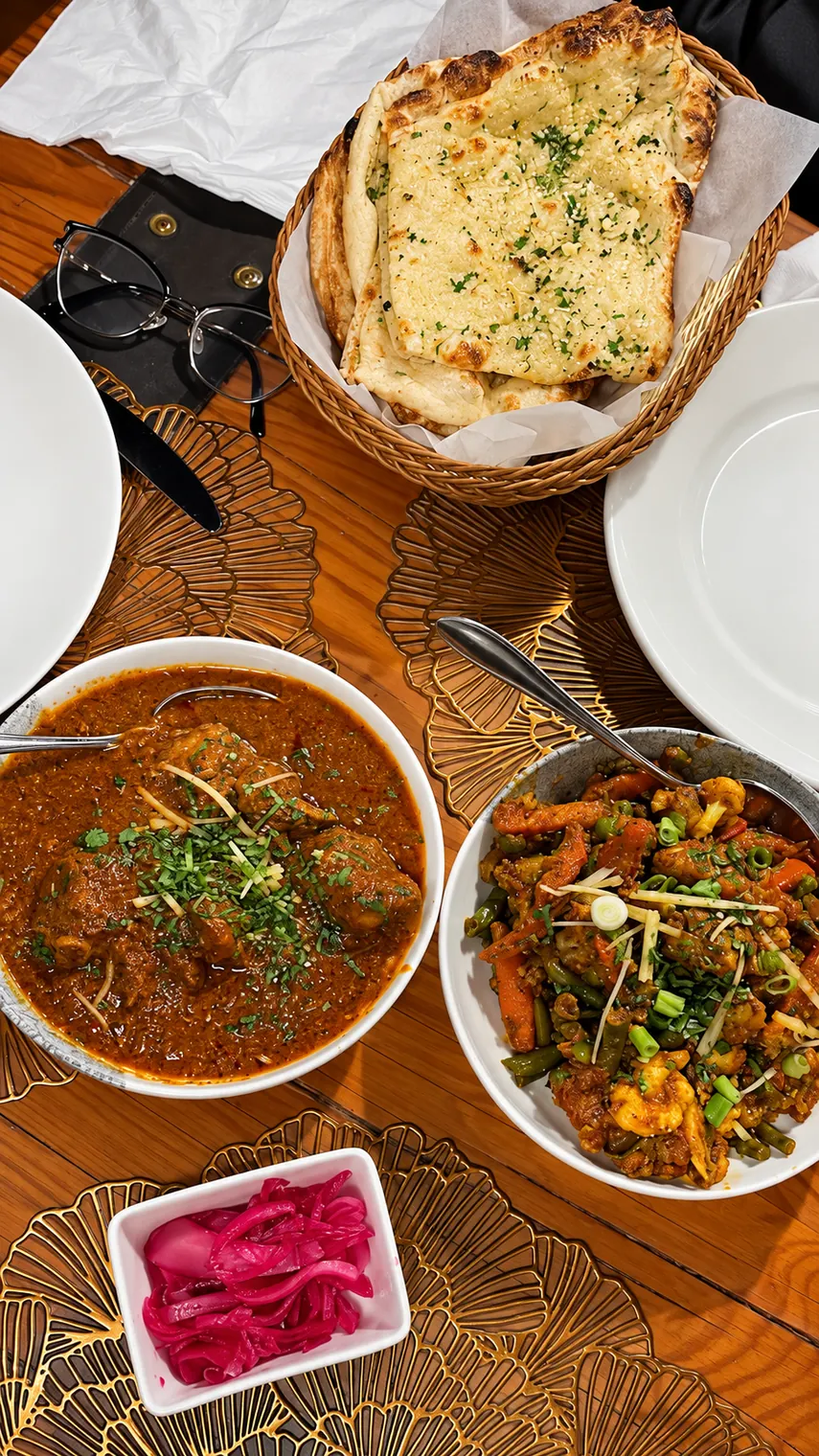 Real Agnii dining table with naan in a basket