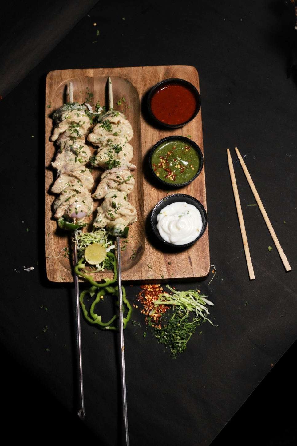 Creamy grilled tikka on skewers with chutneys
