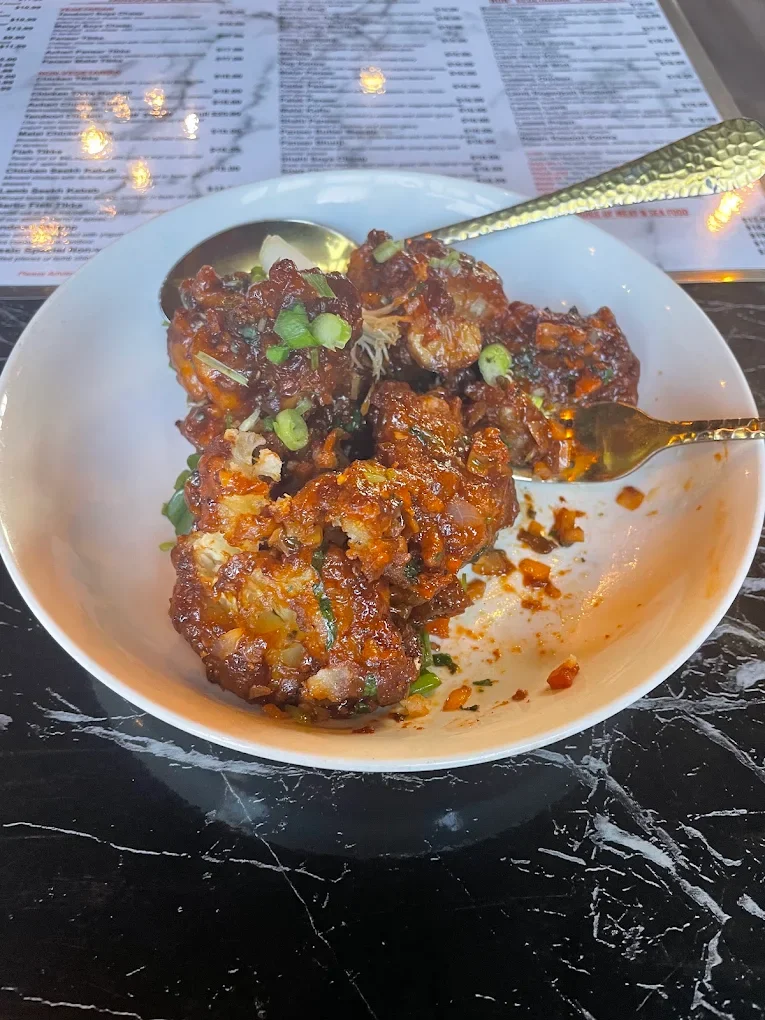 Saucy appetizer garnished with green onions