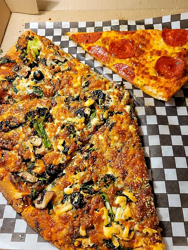 Two fresh pizza slices photographed at Espania Pizzeria