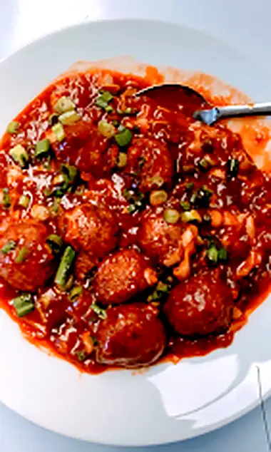 Photograph of a saucy appetizer from Espania Pizzeria