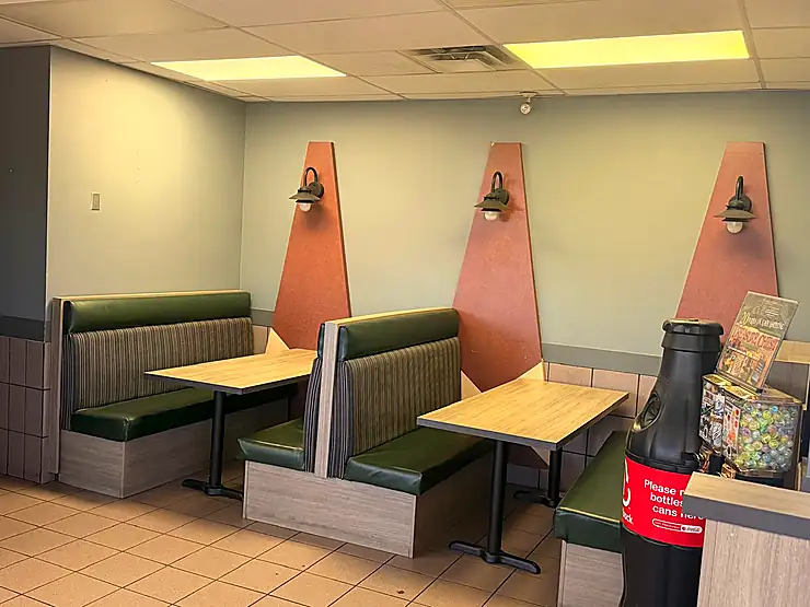 Genuine seating area at Espania Pizzeria with comfortable restaurant booths