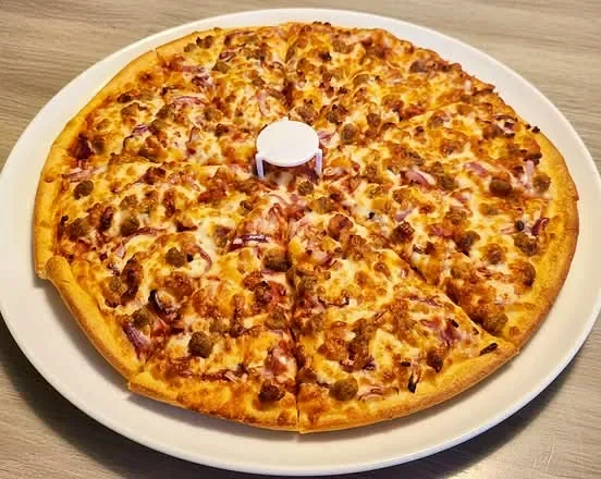 Fresh pizza with melted cheese and toppings