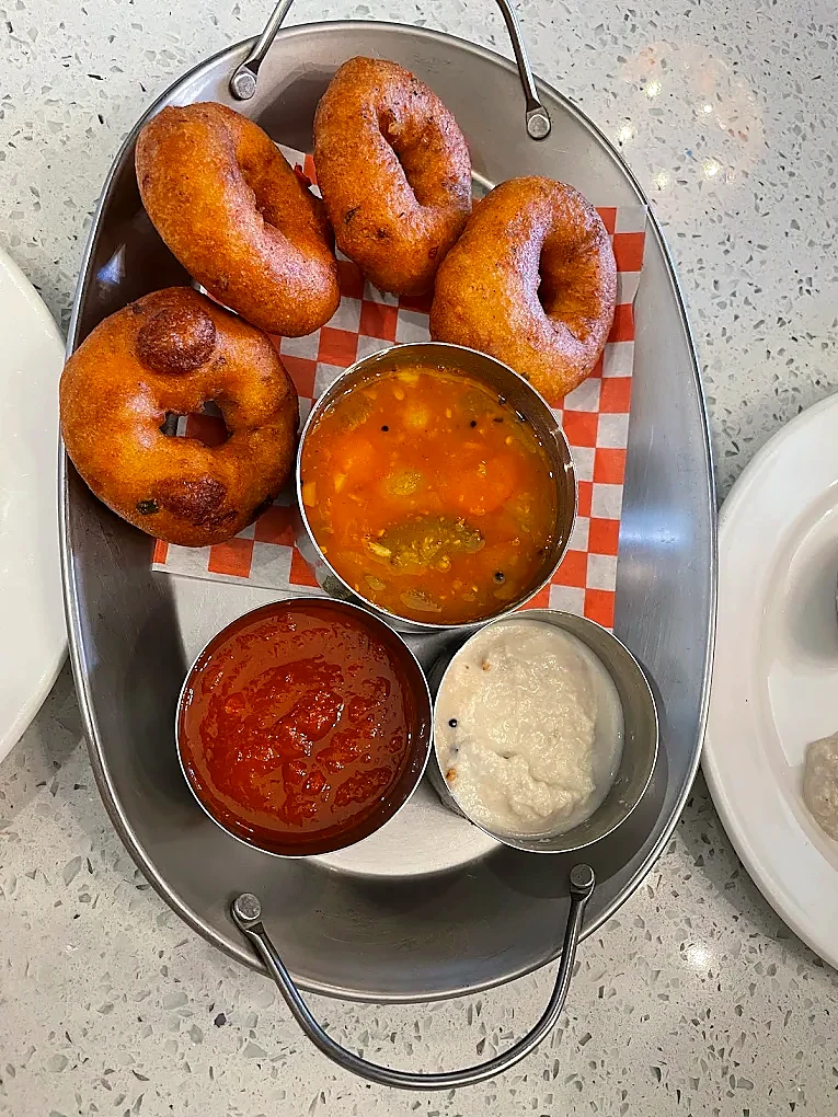 South Indian medu vada with sambar and chutneys