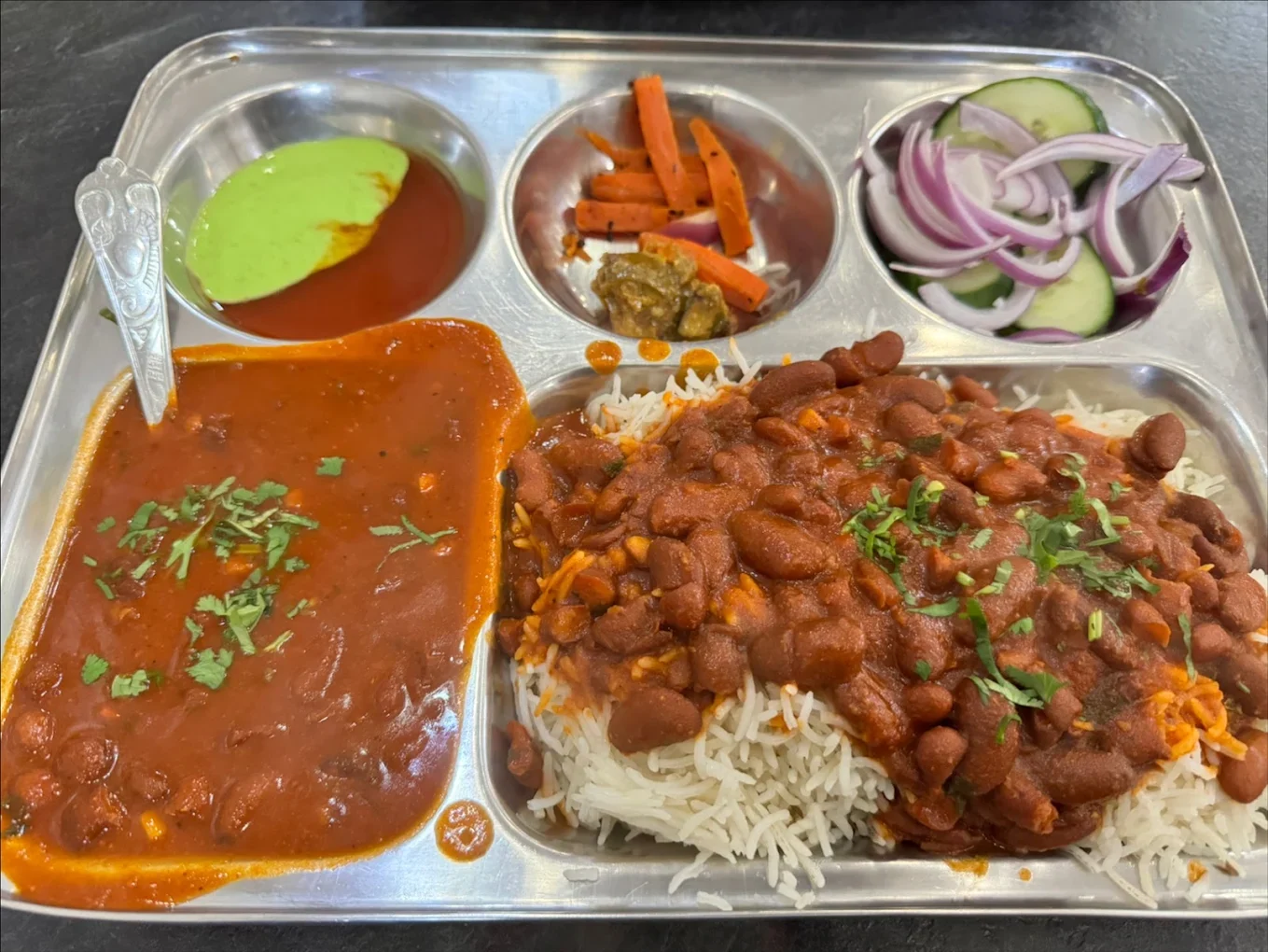 Rajma chawal and curry meal on a thali