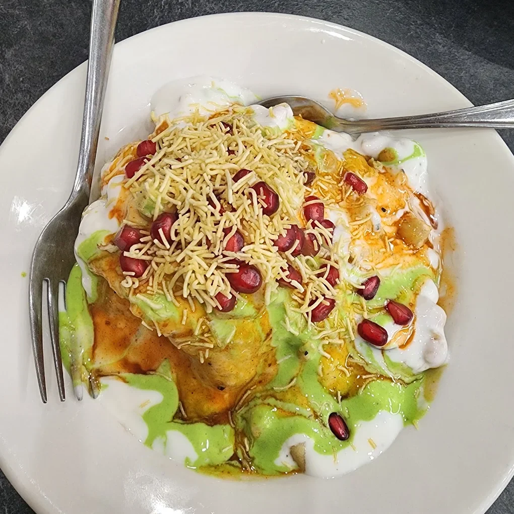 Chaat with sev, pomegranate, yogurt and mint chutney