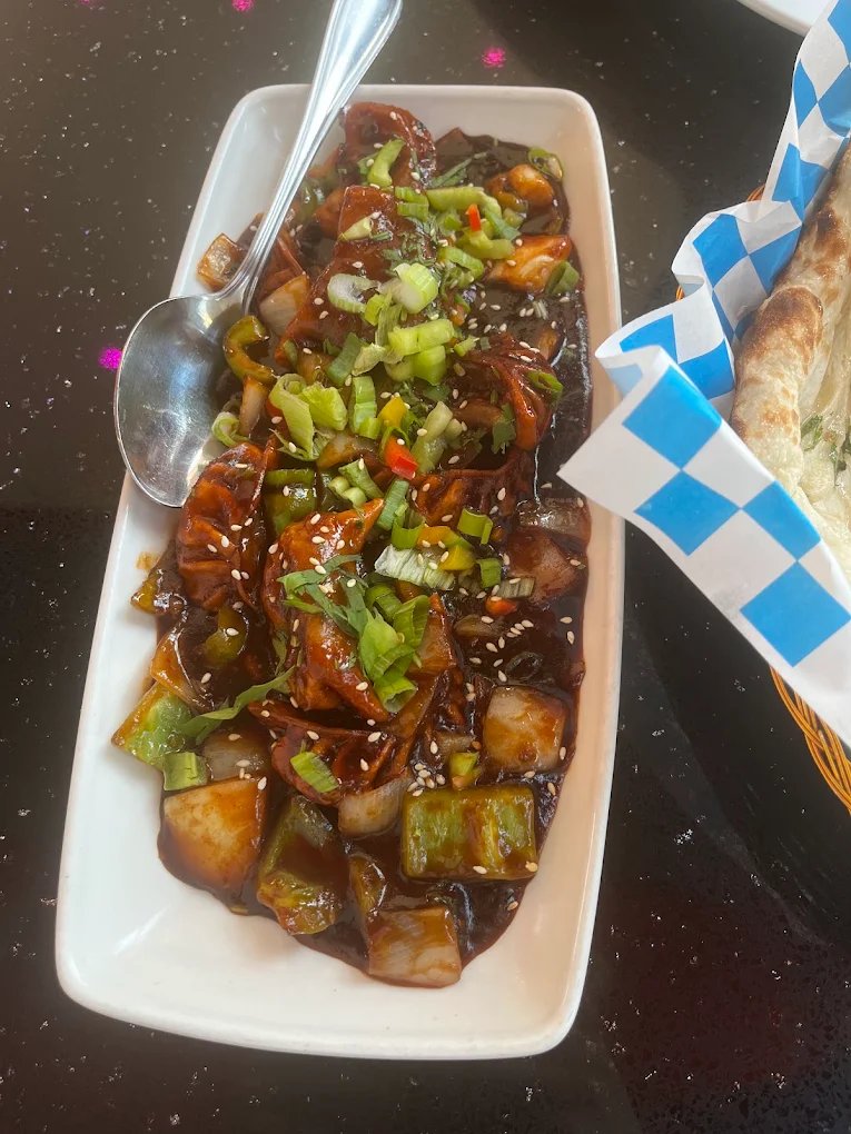 Chilli chicken with peppers and spring onion