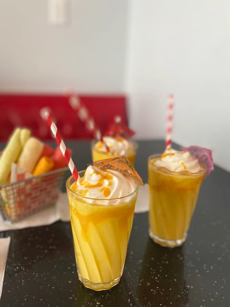 Chilled mango drinks shared at the table