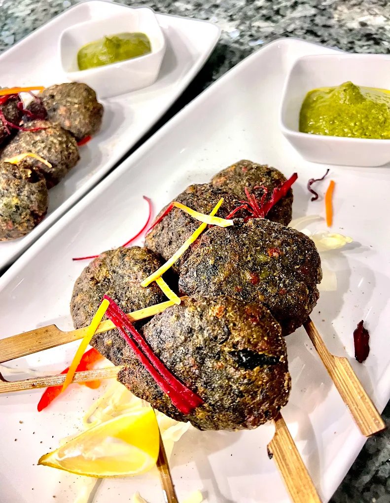 Seekh kebab skewers with green chutney
