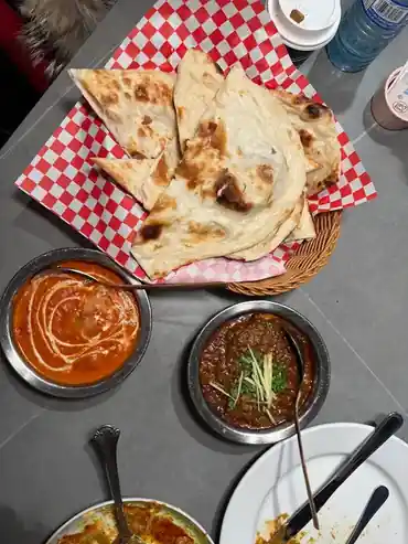 North Indian food including bread, curry and sides