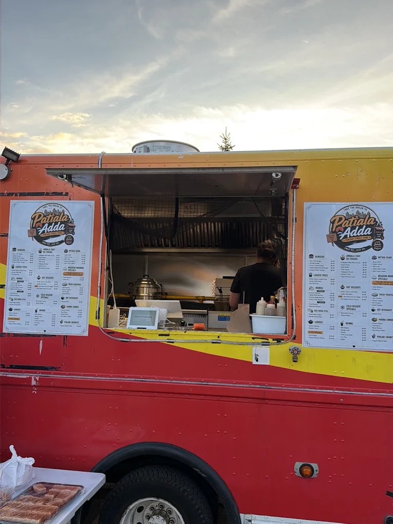 Patiala Adda food truck serving window at sunset